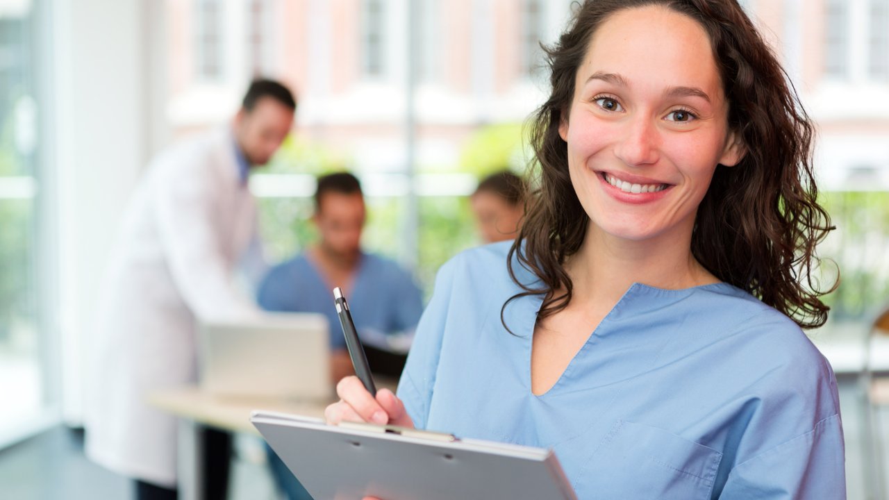 Man in office on phone with laptop